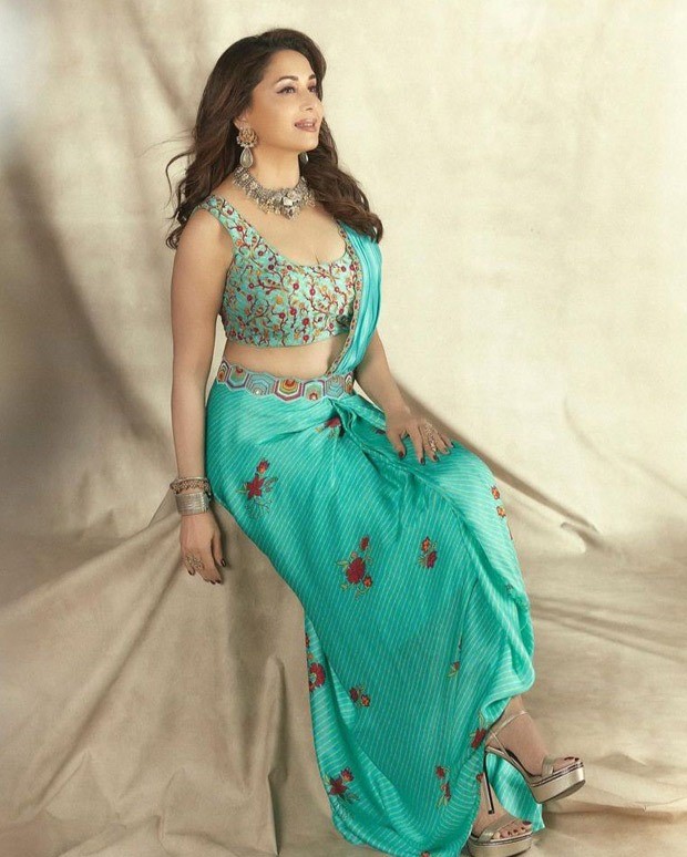 Madhuri Dixit looks gorgeous in a Turquoise pre-draped saree from Punit Balana worth Rs.35,500 Madhuri Dixit looks gorgeous in a Turquoise pre-draped saree from Punit Balana worth Rs.35,500