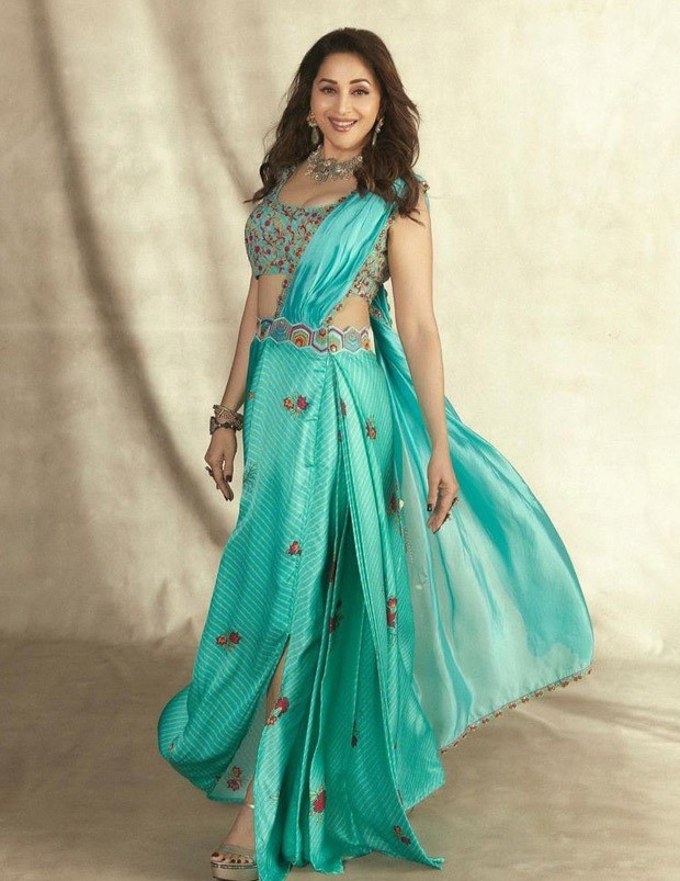 Madhuri Dixit looks gorgeous in a Turquoise pre-draped saree from Punit Balana worth Rs.35,500 Madhuri Dixit looks gorgeous in a Turquoise pre-draped saree from Punit Balana worth Rs.35,500