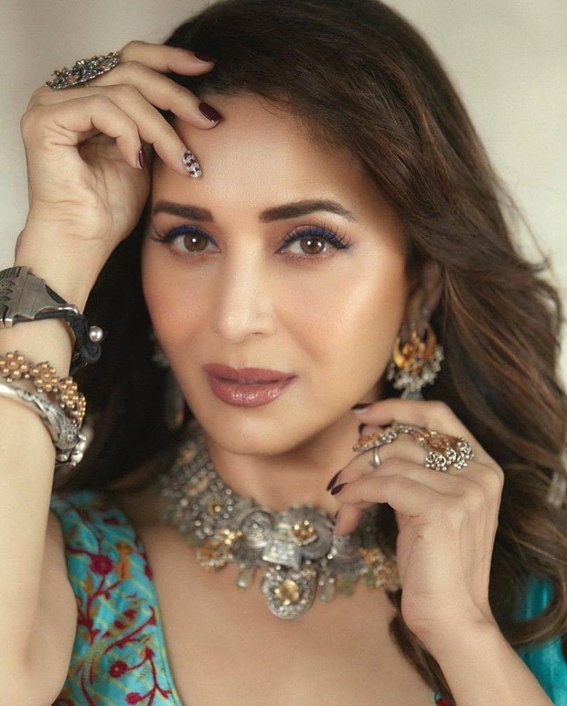 Madhuri Dixit looks gorgeous in a Turquoise pre-draped saree from Punit Balana worth Rs.35,500 Madhuri Dixit looks gorgeous in a Turquoise pre-draped saree from Punit Balana worth Rs.35,500