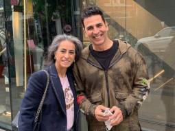 Akshay Kumar strikes a pose with a fan on the streets of London
