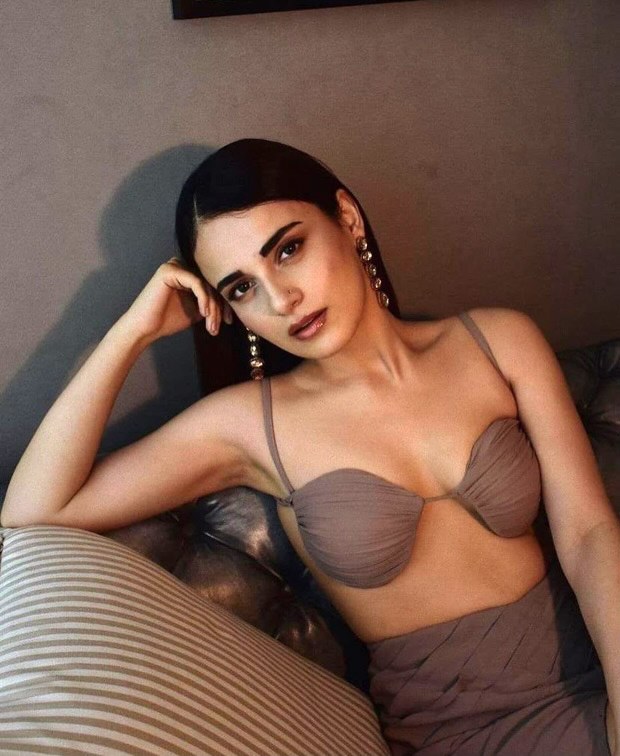 Radhika Mandan goes bold in a sexy nude brown bralette and draped skirt
