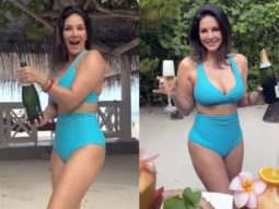 Sunny Leone raises the temperature in a blue and peach bikinis on the beach in Maldives