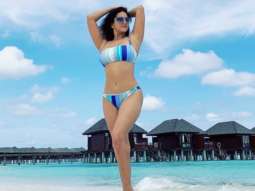 Sunny Leone turns up the heat in a sultry striped striped blue bikini in Maldives