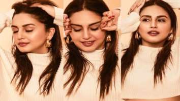 Huma Qureshi pairs beige knitted crop top and high profile waisted skirt and sneakers