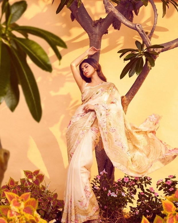 Mouni Roy enjoys in the festive season in a gorgeous beige floral saree Mouni Roy enjoys in the festive season in a gorgeous beige floral saree