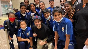 Varun Dhawan poses with the Indian Women’s Football team at the airport