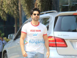 Photos: Varun Dhawan spotted in a white T-shirt and blue denim pants at Sajid Nadiadwala’s office in Andheri