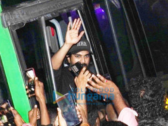 Photos: Ram Charan greets fans as he arrives to watch the early morning show of RRR in Hyderabad