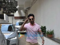 Photos: Varun Dhawan spotted outside Dharma Productions’ office in a pink T-shirt and khakhee pants