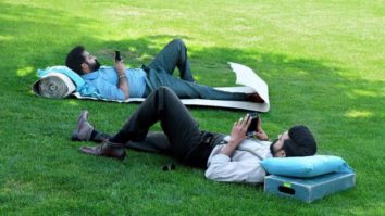 RRR: Ram Charan and Jr NTR cool down in an open field as producers drop a funny picture RRR: Ram Charan and Jr NTR cool down in an open field as producers drop a funny picture