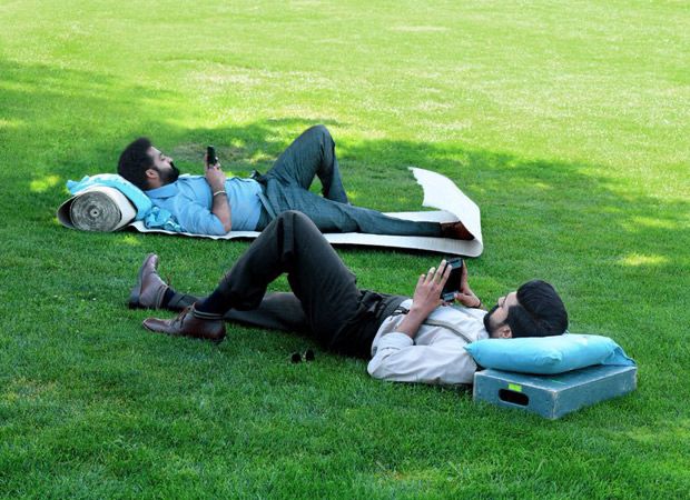 RRR: Ram Charan and Jr NTR cool down in an open field as producers drop a funny picture RRR: Ram Charan and Jr NTR cool down in an open field as producers drop a funny picture