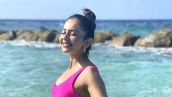Rakul Preet Singh shows off her toned beach body in a bright pink bikini in Maldives