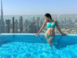 Shanaya Kapoor is a smokeshow in an aqua cut-out one-shoulder bikini while soaking in the sun in Dubai
