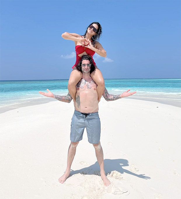 Sunny Leone dons maroon swimsuit as she sits on husband Daniel Weber's shoulder to capture perfect moment in Maldives