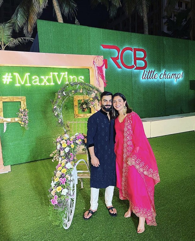 Anushka Sharma shares stunning pictures with husband Virat Kohli donning fuschia pink suit worth Rs. 16,900 from Glen Maxwell’s wedding
