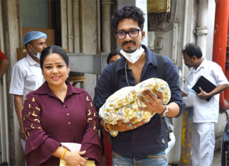 Bharti Singh and Harsh Limbachiyaa pose with their baby boy outside hospital