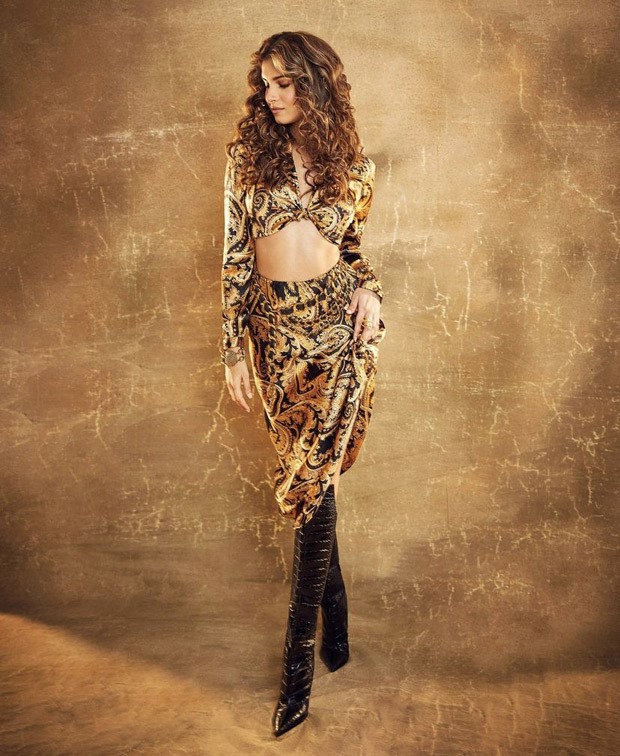 Tara Sutaria exudes retro vibes with vintage printed crop-top and skirt, curls and Christian Louboutin boots for Heropanti 2 promotions