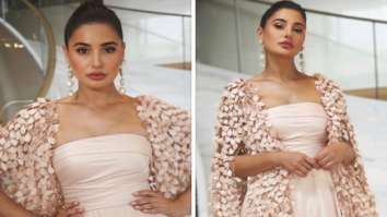 Cannes 2022: Nargis Fakhri emanates her charm in pastel pink off-shoulder gown with feathered cape