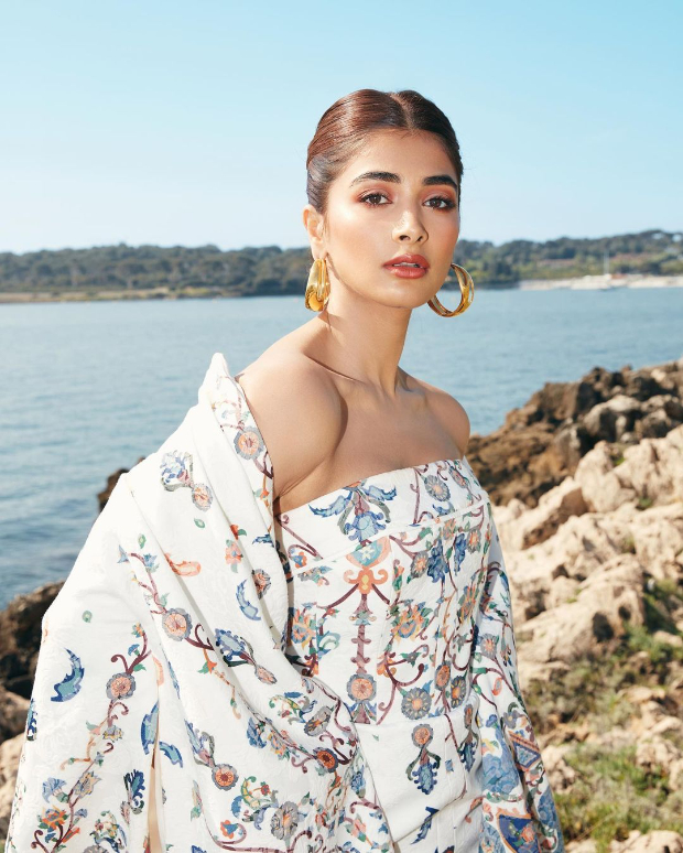 Cannes 2022: Pooja Hegde is epitome of grace and panache in floral printed jacquard strapless dress and long cape worth over Rs. 2 lakh 
