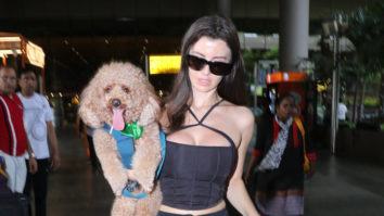 Giorgia Andriani spotted at the airport playing with a dog