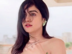 Adah Sharma poses with a lizard wearing a leafy dress
