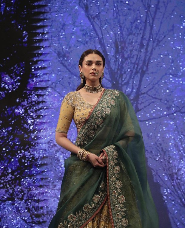 Aditi Rao Hydari is an elegant showstopper as she walks at couture week in dull gold lehenga by Anju Modi