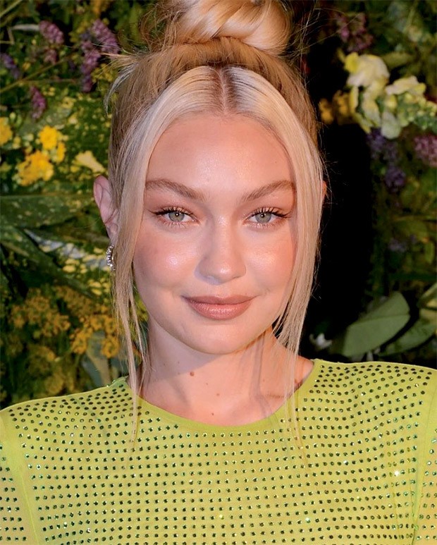 Gigi Hadid amps up the glam in a green body-con dress for British Vogue X Self Portrait's Summer Party in London Gigi Hadid amps up the glam in a green body-con dress for British Vogue X Self Portrait's Summer Party in London