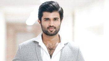 Vijay Deverakonda waves at paps