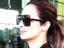 Malaika Arora looks airport ready in black top and denims