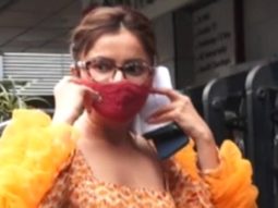 Rubina Dilaik poses for paps in an orange ruffled sleeve outfit