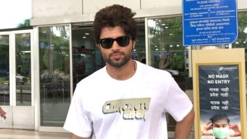 Vijay Deverakonda poses for a selfie with fans at the airport