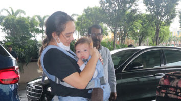 Hazel Keech snapped at the airport with her cute baby boy