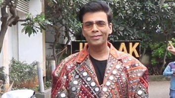 Karan Johar poses in funky mirrored jacket