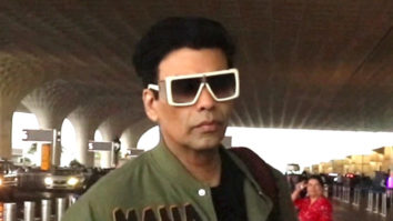Karan Johar walks in swag at the airport