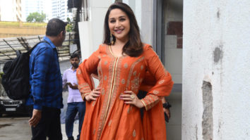 Madhuri Dixit makes us swoon as she looks beautiful in orange outfit