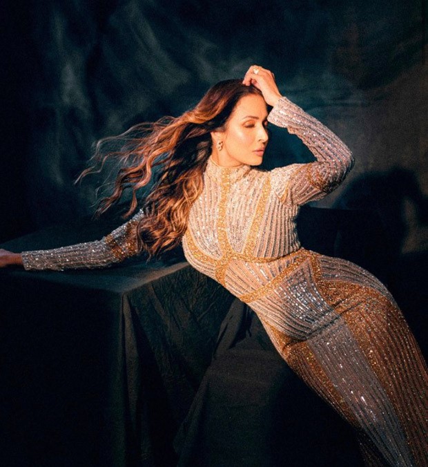 Malaika Arora exudes glitz and glam in a gold shimmering body-con gown Malaika Arora exudes glitz and glam in a gold shimmering body-con gown