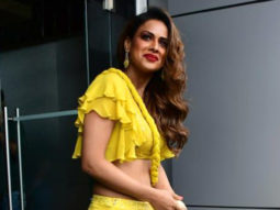 Nia Sharma smiles brightly in yellow outfit and red lip