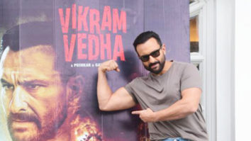 Saif Ali Khan poses with Vikram Vedha poster pre-release