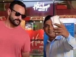 Saif Ali Khan poses with fans at the airport