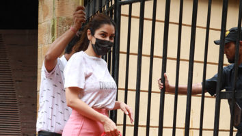 Sophie Choudry takes her dog for a stroll