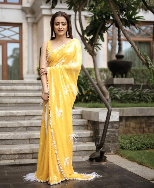 Trisha Krishnan is a sight to behold in yellow sequined saree by Neeta Lulla for Ponniyin Selvan-1 promotions