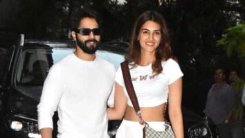 Varun Dhawan and Kriti Sanon twin in white as they pose together