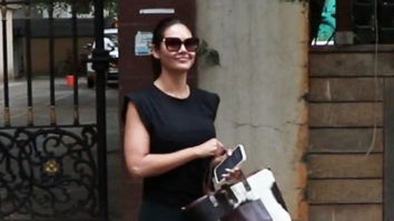 Esha Gupta smiles for paps in black outfit
