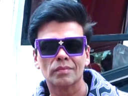 Karan Johar slays in a funky purple jacket with Amruta Khanvilkar at Jhalak Dikhhla Jaa sets