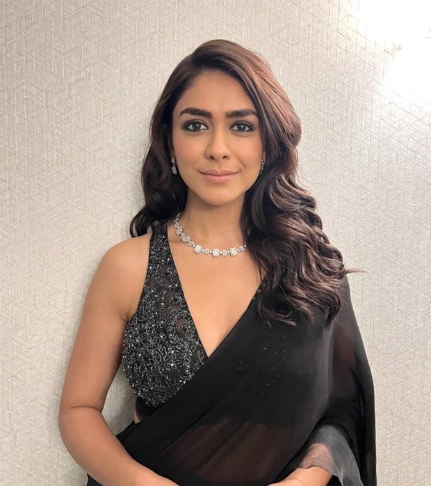 Mrunal Thakur looks like a bombshell in black saree and sequined black and silver blouse