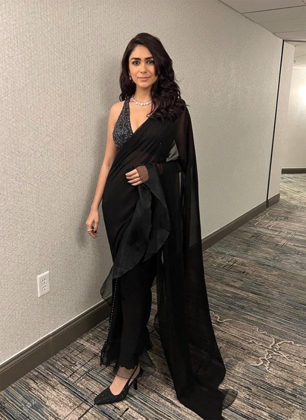 Mrunal Thakur looks like a bombshell in black saree and sequined black and silver blouse