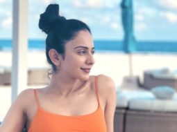Rakul Preet Singh says, “Thank God for a holiday” as she relaxes on the beach in the Maldives while wearing an orange swimsuit
