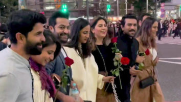 Ram Charan and Jr NTR walk with pride holding a rose on RRR’s background music