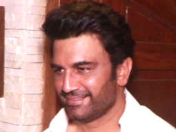 Sharad Kelkar smiles in a white shirt as he poses for paps