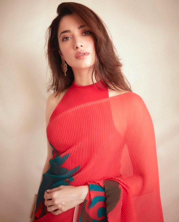 Tamannaah Bhatia amps up the drama with an 18k crimson pleated saree and halter neck blouse